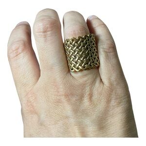 Vintage gold plated wide ladies fashion ring; an open basketweave pattern